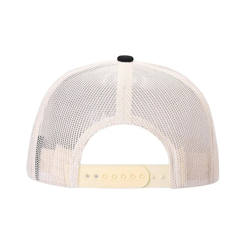 Waycap Mesh back trucker hat with suede bill and adjustable snapback closure in cream and black.