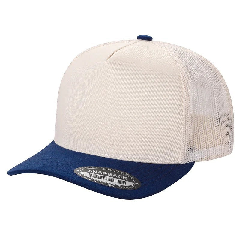 Waycap Mesh trucker hat in cream with a navy blue suede bill and snapback closure.