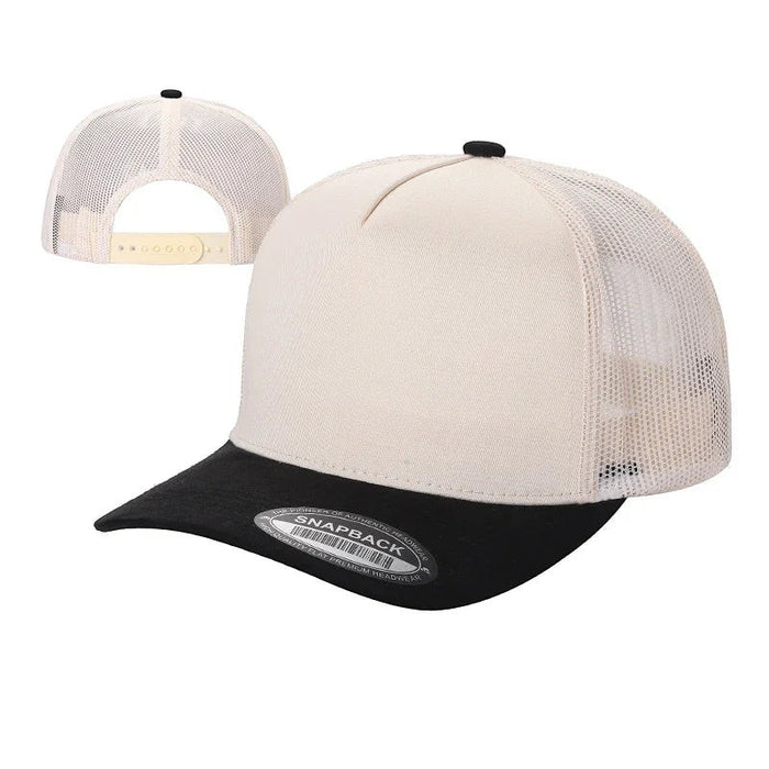 Waycap Mesh trucker hat with a cream crown and black suede bill. Features a breathable mesh back and adjustable snapback.